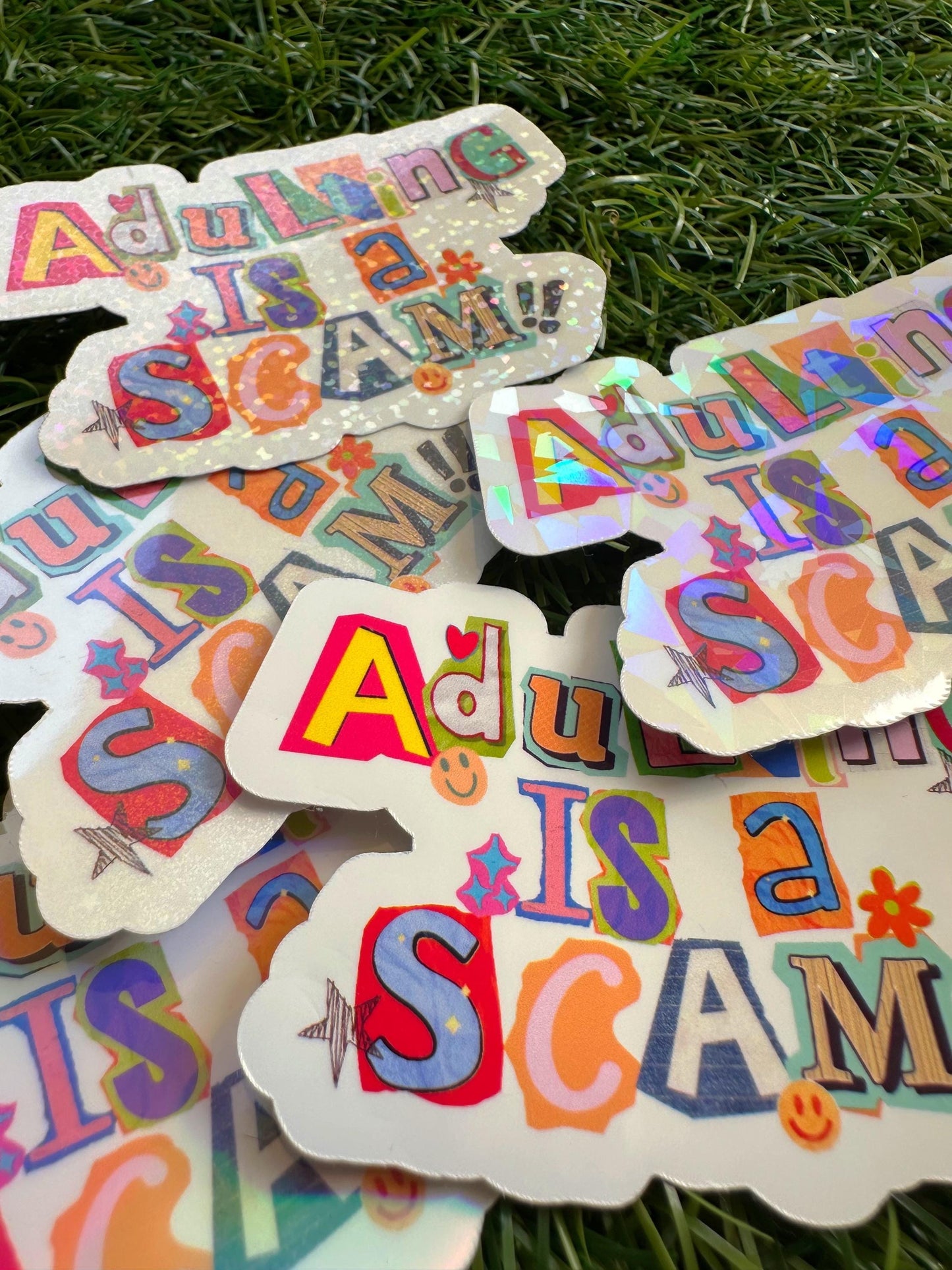 Adulting Is a Scam Sticker | Funny Sarcastic Vinyl Decal for Laptop & Water Bottle
